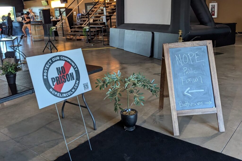 The entryway to a Sept. 26, 2024 public forum from Neighbors Opposed to Prison Expansion, which is working to upend South Dakota's plans for a new men's prison in Lincoln County. (John Hult/South Dakota Searchlight)
