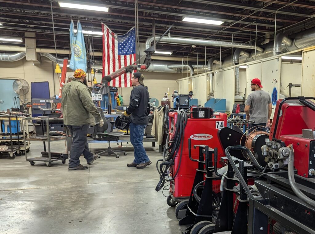 Participants in a welding program for minimum security inmates are pictured at Southeast Technical College in Sioux Falls on Oct. 7, 2024. (John Hult/South Dakota Searchlight)