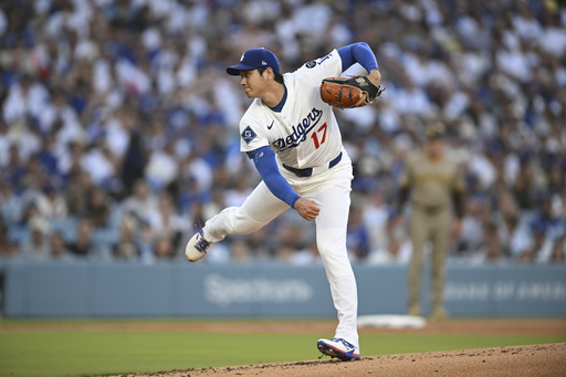 Los Angeles Dodgers starting pitcher Shohei Ohtani throws to a San Diego Padres batter during the first inning of a baseball game Monday, June 16, 2025, in Los Angeles. (AP Photo/Kyusung Gong)
