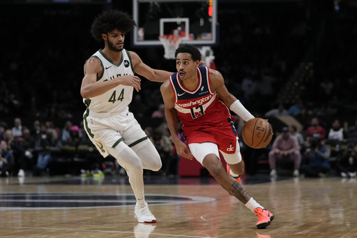 FILE - Milwaukee Bucks guard Andre Jackson Jr. (44) and Washington Wizards guard Jordan Poole (13) in action during the second half of an NBA basketball game in Washington, Nov. 20, 2023. (AP Photo/Mark Schiefelbein, File)