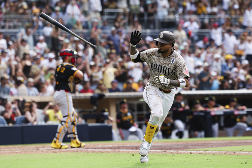 San Diego Padres' Luis Arraez tosses his bat after hitting an RBI single against the Pittsburgh Pirates in the seventh inning of a baseball game Sunday, June 1, 2025, in San Diego. (AP Photo/Derrick Tuskan)