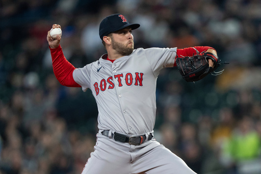 FILE - Boston Red Sox starter Kutter Crawford delivers a pitch against the Seattle Mariners during a baseball game, Saturday, March 30, 2024, in Seattle. (AP Photo/Stephen Brashear, File)