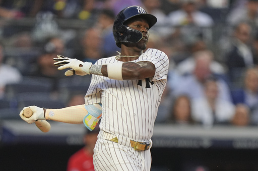 New York Yankees' Jazz Chisholm Jr. hits an RBI single during the second inning of a baseball game against the Boston Red Sox, Friday, June 6, 2025, in New York. (AP Photo/Frank Franklin II)