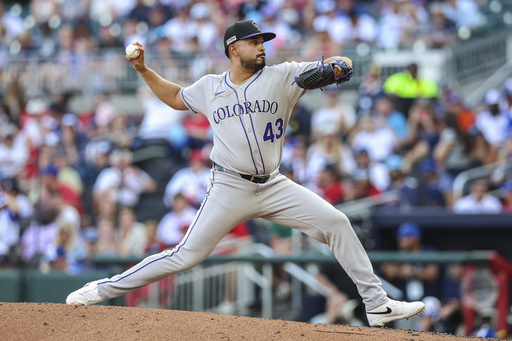 Colorado Rockies pitcher Anthony Molina (43) delivers in the eighth inning of a baseball game against the Atlanta Braves, Saturday, June 14, 2025, in Atlanta. (AP Photo/Colin Hubbard)