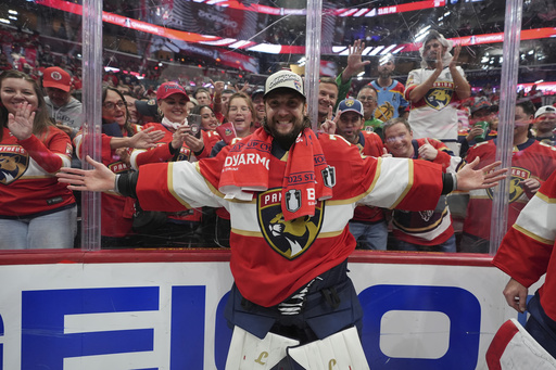 Florida Panthers goaltender Sergei Bobrovsky poses in front of fans after winning the Stanley Cup in Game 6 of the NHL hockey Stanley Cup Final against the Edmonton Oilers Tuesday, June 17, 2025, in Sunrise, Fla. (AP Photo/Lynne Sladky)