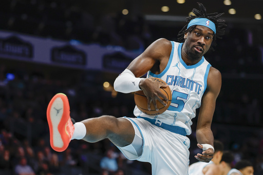 FILE - Charlotte Hornets center Mark Williams pulls down a rebound against the Utah Jazz during the first half of an NBA basketball game in Charlotte, N.C., Monday, March 31, 2025. (AP Photo/Nell Redmond, File)