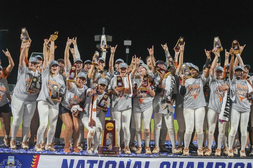 The Texas Longhorns softball team celebrates after defeating Texas Tech 10-4 to win the Women's College World Series championship in Oklahoma City, Friday, June 6, 2025. (AP Photo/Kyle Phillips)