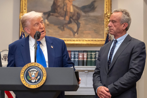 FILE - President Donald Trump, from left, speaks as Health and Human Services Secretary Robert F. Kennedy Jr., during an event in the Roosevelt Room at the White House, May 12, 2025, in Washington. (AP Photo/Mark Schiefelbein, File)