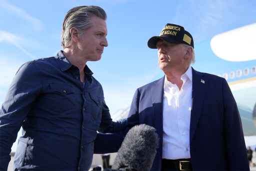 FILE - President Donald Trump talks with California Gov. Gavin Newsom after arriving on Air Force One at Los Angeles International Airport in Los Angeles, Jan. 24, 2025. (AP Photo/Mark Schiefelbein, File)