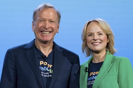 Points of Light president and CEO Jennifer Sirangelo and Neil Bush, chair, speak at the 2025 Points of Light Conference in New Orleans, Friday, June 6, 2025. (AP Photo/Matthew Hinton)