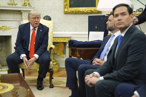 President Donald Trump, left, speaks during a meet withGermany's Chancellor Friedrich Merz, not pictured, as Secretary of State Marco Rubio, from right, and Vice President JD Vance listen in the Oval Office of the White House, Thursday, June 5, 2025, in Washington. (AP Photo/Evan Vucci)