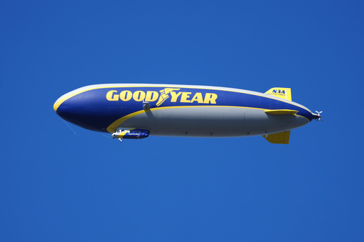 FILE - A Goodyear blimp flies over Michigan Stadium in the first half of an NCAA college football game between Michigan and Southern California in Ann Arbor, Mich., Saturday, Sept. 21, 2024. (AP Photo/Paul Sancya, File)
