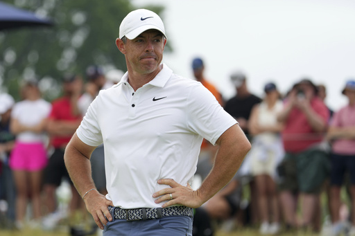 Rory McIlroy, of Northern Ireland, stands on the 11th green after putting in during the final round of the U.S. Open golf tournament at Oakmont Country Club Sunday, June 15, 2025, in Oakmont, Pa. (AP Photo/Gene J. Puskar)