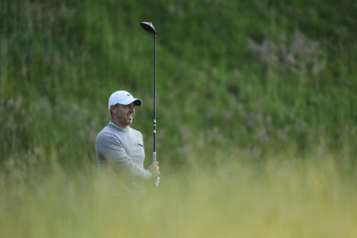 Rory McIlroy, of Northern Ireland, watches his shot on the seventh hole during a practice round ahead of the U.S. Open golf tournament at Oakmont Country Club Wednesday, June 11, 2025, in Oakmont, Pa. (AP Photo/Charlie Riedel)