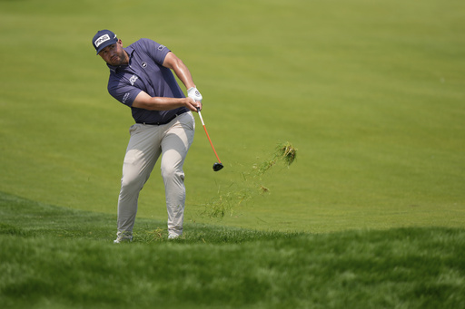 Thriston Lawrence, of South Africa, hits from the 18th fairway during the first round of the U.S. Open golf tournament at Oakmont Country Club Thursday, June 12, 2025, in Oakmont, Pa. (AP Photo/Charlie Riedel)