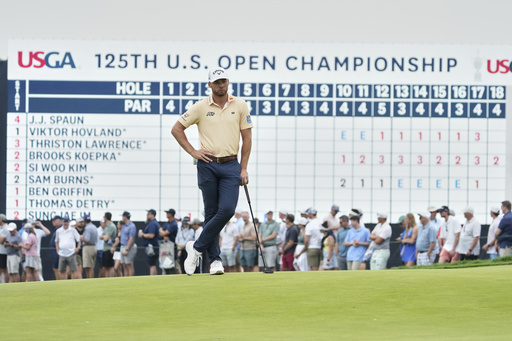 Sam Burns waits to putt on the 18th hole during the second round of the U.S. Open golf tournament at Oakmont Country Club Friday, June 13, 2025, in Oakmont, Pa. (AP Photo/Gene J. Puskar)