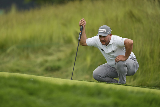 Thriston Lawrence, of South Africa, lines up a putt on the 12th hole during the second round of the U.S. Open golf tournament at Oakmont Country Club Friday, June 13, 2025, in Oakmont, Pa. (AP Photo/Seth Wenig)