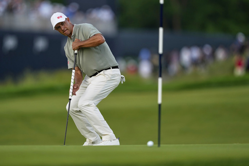 Adam Scott, of Australia, reacts after missing a putt on the 16th hole during the third round of the U.S. Open golf tournament at Oakmont Country Club Saturday, June 14, 2025, in Oakmont, Pa. (AP Photo/Carolyn Kaster)