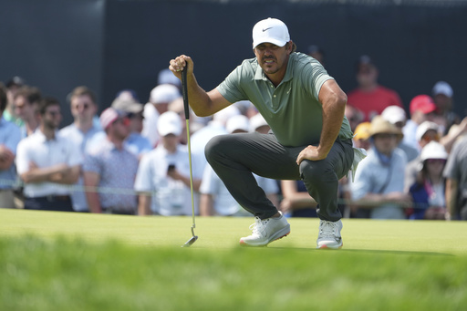 Brooks Koepka lines up a putt on the ninth hole during the first round of the U.S. Open golf tournament at Oakmont Country Club Thursday, June 12, 2025, in Oakmont, Pa. (AP Photo/Gene J. Puskar)