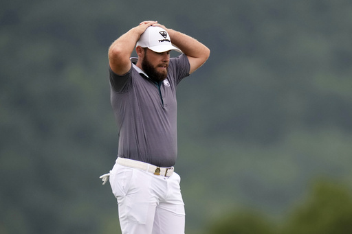 Tyrrell Hatton, of England, reacts after hitting his ball into the rough on the 17th hole during the final round of the U.S. Open golf tournament at Oakmont Country Club Sunday, June 15, 2025, in Oakmont, Pa. (AP Photo/Seth Wenig)