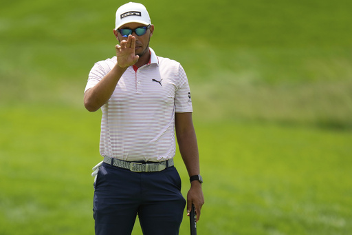 Chase Johnson lines up a putt on the fifth hole during a practice round ahead of the U.S. Open golf tournament at Oakmont Country Club Tuesday, June 10, 2025, in Oakmont, Pa. (AP Photo/Seth Wenig)