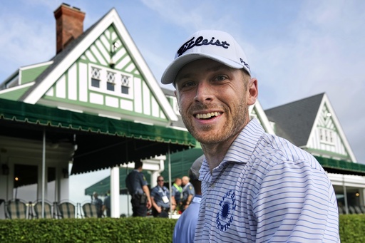 Matt Vogt walks past the clubhouse to the first tee for a practice round for the 2025 US Open golf championship at Oakmont Country Club in Oakmont, Pa. Monday, June 9, 2025. (AP Photo/Gene J. Puskar)