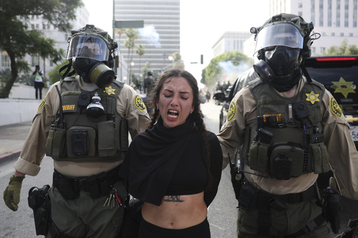 Los Angeles County Sheriffs arrest a demonstrator during a protest Saturday, June 14, 2025, in Los Angeles. (AP Photo/Ethan Swope)