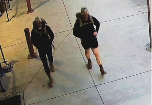 An image taken from Joint Base Lewis-McChord surveillance footage depicts two men identified by the Army Criminal Investigations Division as suspects in an assault and robbery in the 75th Ranger Central Operations Facility on June 1, 2025, at Joint Base Lewis-McChord, Wash. (Army Criminal Investigations Division via AP)