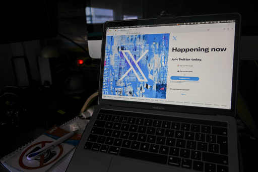FILE - A view of a laptop shows an X sign-in page and logo, in Belgrade, Serbia, July 24, 2023. (AP Photo/Darko Vojinovic, File)