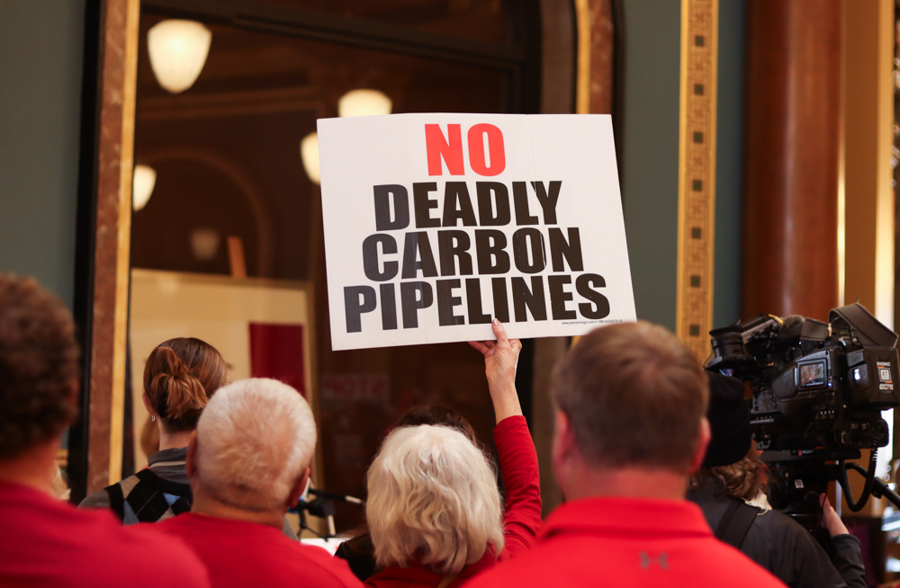 Iowans gathered at the Iowa State Capitol to rally against carbon dioxide pipeline projects March 18, 2025. (Photo by Cami Koons/Iowa Capital Dispatch)