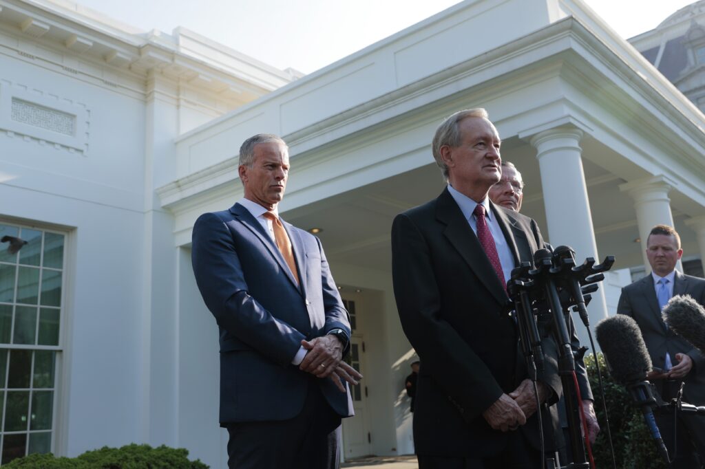 U.S. Senate Majority Leader John Thune, R-S.D., left, listens as Sen. Mike Crapo, R-Idaho, speaks to reporters outside of the West Wing of the White House on June 4, 2025 in Washington, D.C.  after a meeting with President Donald Trump. (Photo by Anna Moneymaker/Getty Images)