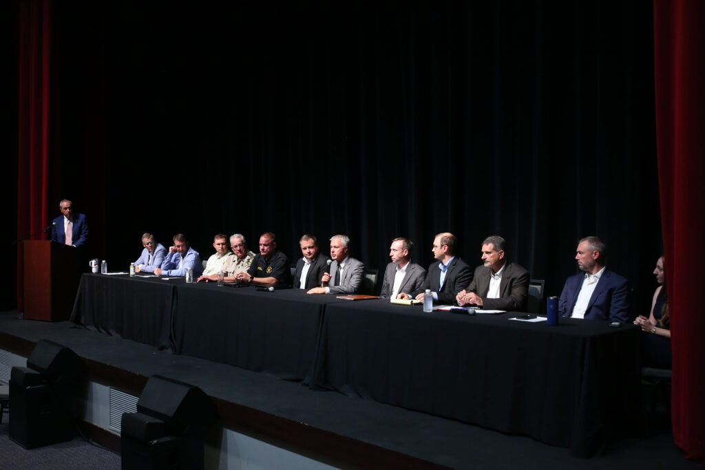 Law enforcement, Sioux Falls officials and legislators participate in a forum on July 22, 2025, in downtown Sioux Falls about the proposed construction of a men's prison in the northeastern part of the city. (Makenzie Huber/South Dakota Searchlight)