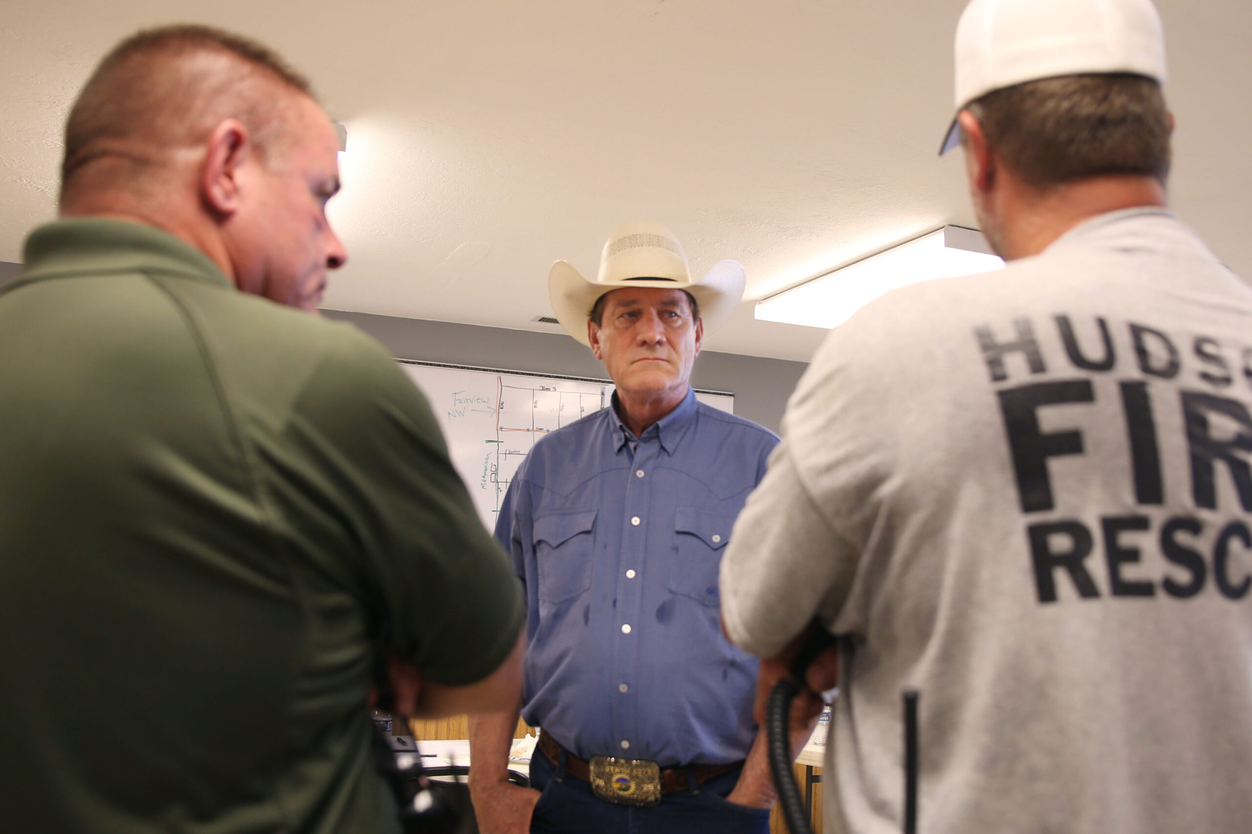 South Dakota Gov. Larry Rhoden speaks to local officials in the Hudson City Office on Tuesday, July 29, 2025 after surveying damage from a wind storm that moved through the area on Monday evening. The system damaged trees, homes and other structures. (Makenzie Huber/South Dakota Searchlight)