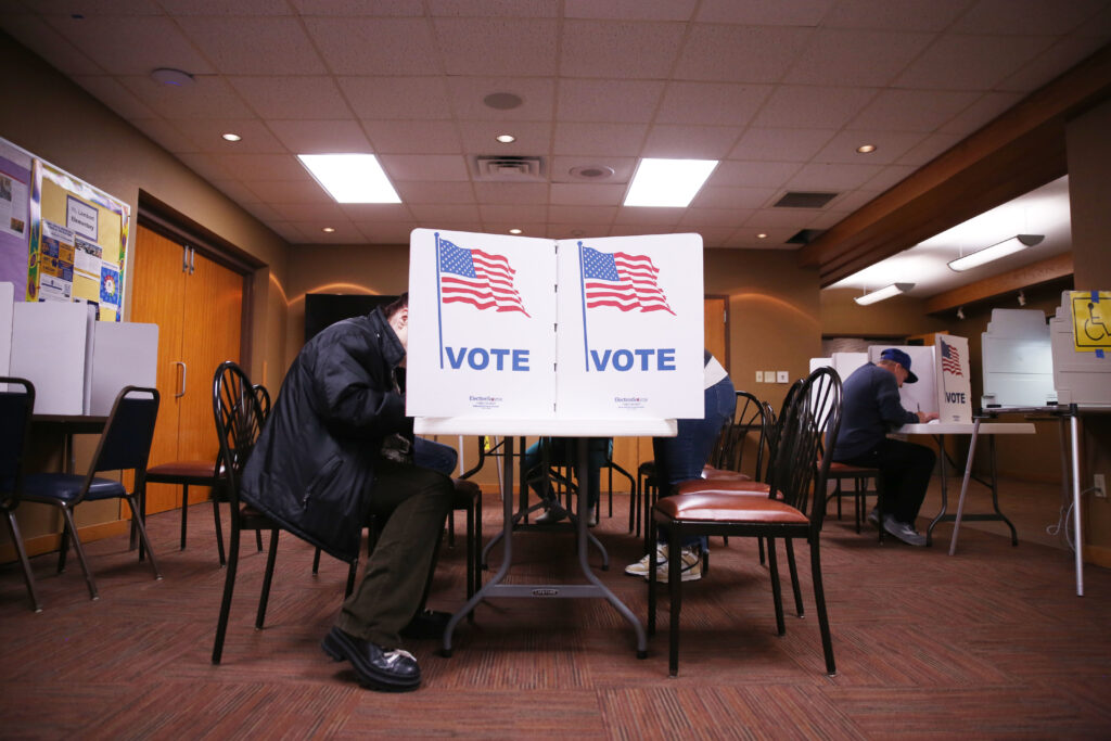 A Sioux Falls resident votes in the general election on Nov. 5, 2024, at St. Lambert's Catholic Church. (Makenzie Huber/South Dakota Searchlight)