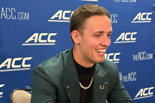 Miami quarterback Carson Beck, who transferred from Georgia, speaks at the Atlantic Coast Conference NCAA college football media days, Tuesday, July 22, 2025, in Charlotte, N.C. (AP Photo/Steve Reed)