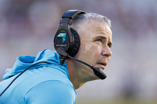 FILE - Florida State head coach Mike Norvell monitors the second half of an NCAA college football game against Charleston Southern, Saturday, Nov. 23, 2024, in Tallahassee, Fla. (AP Photo/Colin Hackley, File)