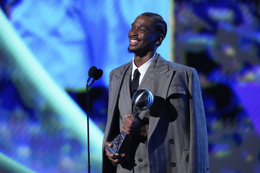 Shai Gilgeous-Alexander smiles after winning the Best Athlete Men's Sports award at the ESPY Awards at the Dolby Theatre in Los Angeles, Wednesday, July 16, 2025. (AP Photo/Mark J. Terrill)