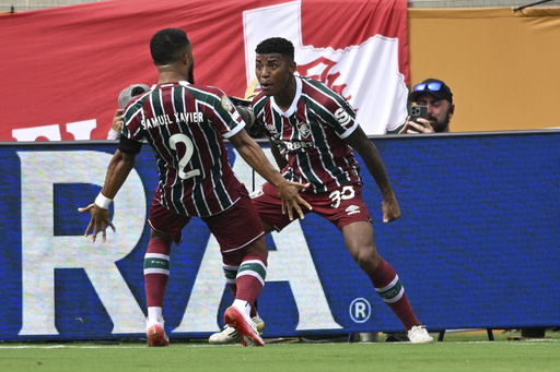 Fluminense's Samuel Xavier, left, and Hercules, right, celebrate after a goal during the Club World Cup quarterfinal soccer match between Fluminense and Al Hilal in Orlando, Fla., Friday, July 4, 2025. (AP Photo/Phelan M. Ebenhack)