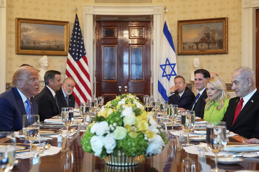 President Donald Trump, left, meets with Israel's Prime Minister Benjamin Netanyahu, right, in the Blue Room of the White House, Monday, July 7, 2025, in Washington. (AP Photo/Alex Brandon)
