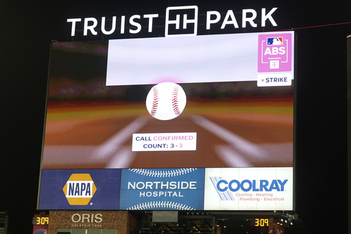 Miami's Kyle Stowers challenge is being reviewed during eighth inning at the MLB baseball All-Star game between the American League and National League, Tuesday, July 15, 2025, in Atlanta. (AP Photo/Brynn Anderson)