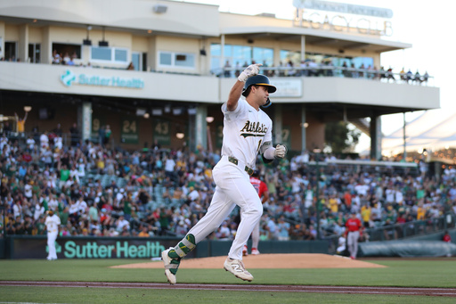 FILE - Athletics' Max Muncy celebrates a two-run home run during the first inning of a baseball game against the Atlanta Braves, Tuesday, July 8, 2025, in West Sacramento, Calif. (AP Photo/Scott Marshall, File)