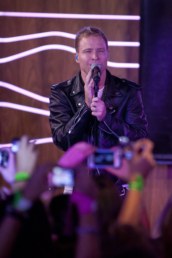FILE - Brian Littrell, of the Backstreet Boys, attends a meeting with fans for the presentation of the album 'In A World Like This' at 40 Cafe in Madrid, Spain, Nov. 12, 2013. (AP Photo/Abraham Caro Marin, file)