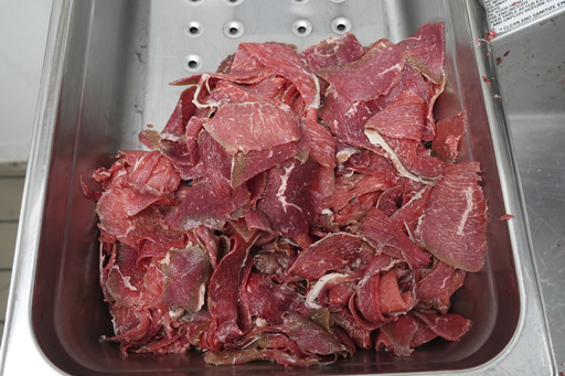 Thinly sliced strips of beef set in a tray for cheesesteaks in a tray at Jim's South St. in Philadelphia, Wednesday, July 23, 2025. (AP Photo/Matt Rourke)