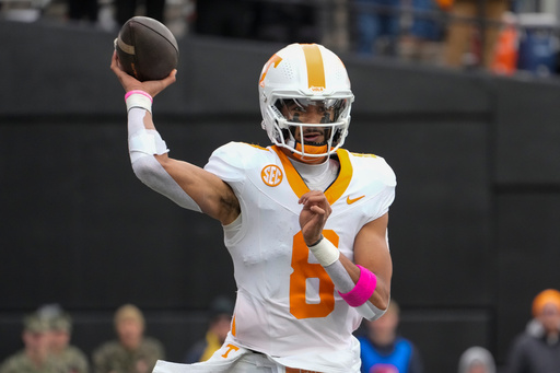 FILE - Tennessee quarterback Nico Iamaleava (8) looks to throw a pass during the first half of an NCAA college football game against Vanderbilt, on Nov. 30, 2024, in Nashville, Tenn. (AP Photo/George Walker IV, File)