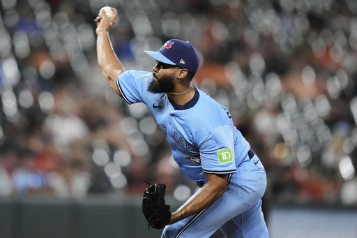 Toronto Blue Jays relief pitcher Seranthony Dominguez delivers during the seventh inning in the second baseball game of a doubleheader against the Baltimore Orioles, Tuesday, July 29, 2025, in Baltimore. (AP Photo/Stephanie Scarbrough)