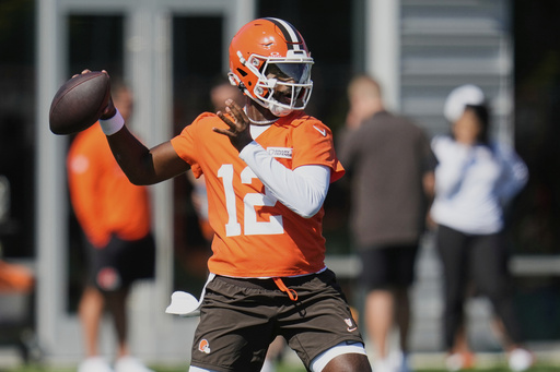 Cleveland Browns quarterback Shedeur Sanders (12) throws during a practice at the team's NFL football training camp Wednesday, July 23, 2025, in Berea, Ohio. (AP Photo/Sue Ogrocki)