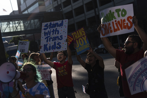 Protesters chant slogans while demonstrating against the closure of the trans youth clinic at Children's Hospital Los Angeles, Thursday, July 3, 2025, in Los Angeles. (AP Photo/Jae C. Hong)