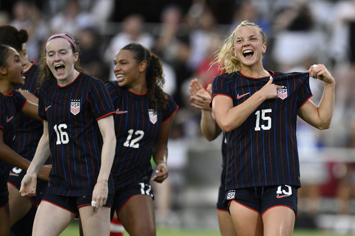 United States midfielder Claire Hutton (15) celebrates her goal with teammates during the first half of an international friendly soccer match against Canada, Wednesday, July 2, 2025, in Washington. (AP Photo/Nick Wass)