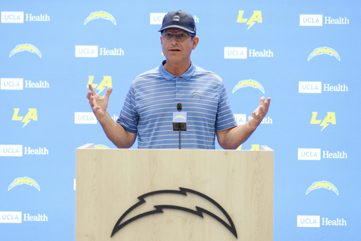 Los Angeles Chargers head coach Jim Harbaugh holds a press conference during training camp for the NFL football team Thursday, July 17, 2025, in El Segundo, Calif. (AP Photo/Eric Thayer)