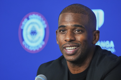 Chris Paul takes questions from the media as he is introduced as the newest member of the Los Angeles Clippers during an NBA basketball news conference in Inglewood, Calif., Monday, July 28, 2025. (AP Photo/Damian Dovarganes)